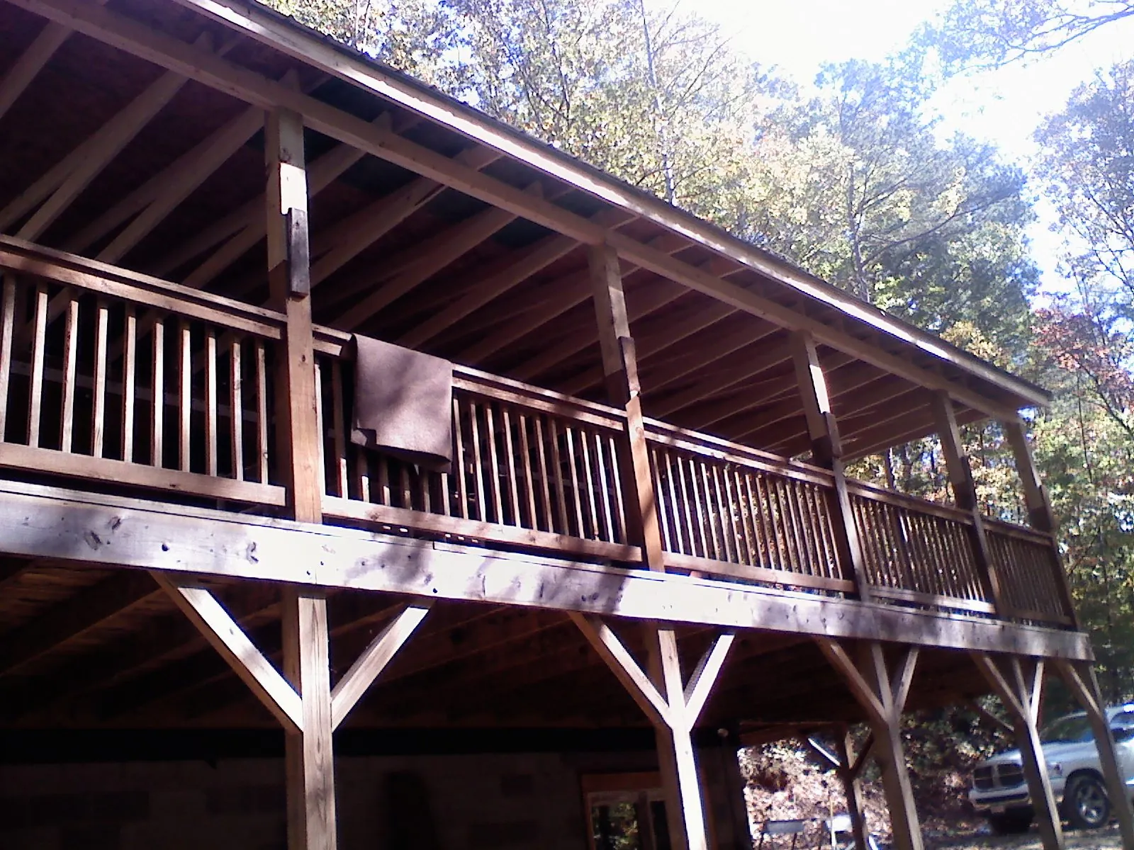 Timber framing under a new elevated porch and deck — Roof Leak Repair in Bentonville by Roofing Brothers
